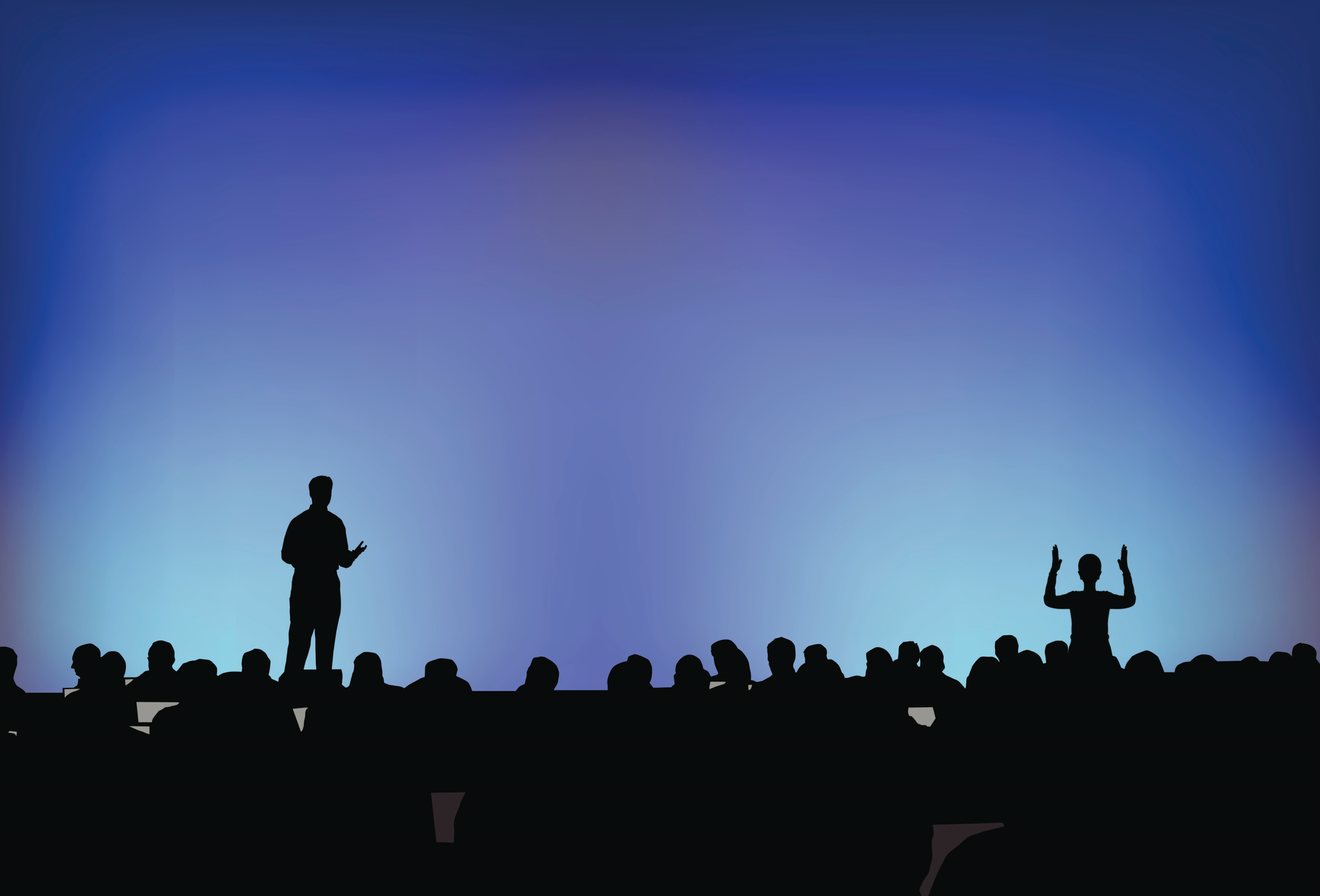 Silhouette of a speaker presenting to a large audience in a dark auditorium with an interpreter to the right of the stage.